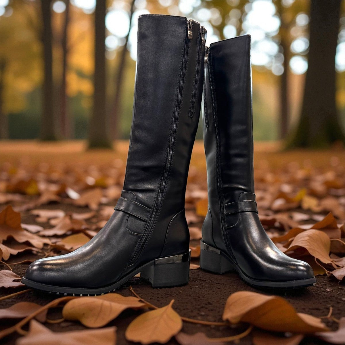 stefania black vegan leather high boots with side zipper, buckle detail, and block heel for winter wear.
photo of the front side
