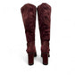 stefania bordo vegan leather knee-high boots with block heel, suede-like panels, and metallic side detail.
photo of the back side