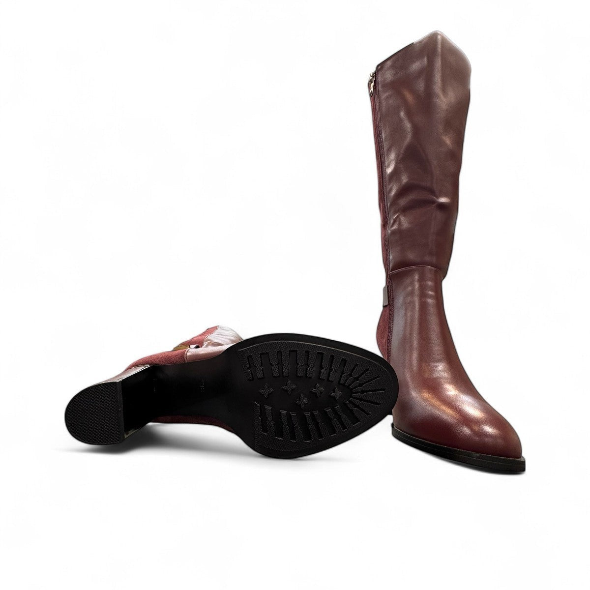 stefania bordo vegan leather knee-high boots with block heel, suede-like panels, and metallic side detail.
photo of the bottom side