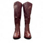 stefania bordo vegan leather knee-high boots with block heel, suede-like panels, and metallic side detail.
photo of the front side
