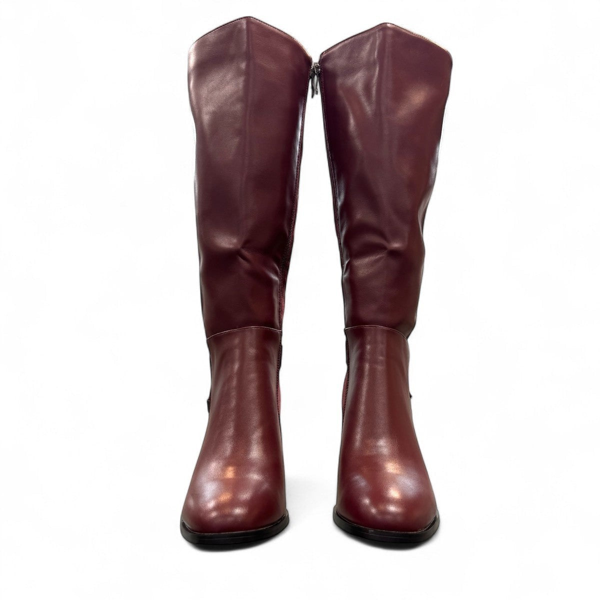 stefania bordo vegan leather knee-high boots with block heel, suede-like panels, and metallic side detail.
photo of the front side