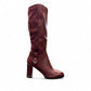 stefania bordo vegan leather knee-high boots with block heel, suede-like panels, and metallic side detail.
photo of the right side
