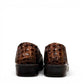 Stefania bronze croc-embossed slip-on shoe with a low wedge sole and elastic side panel.
photo of the back side