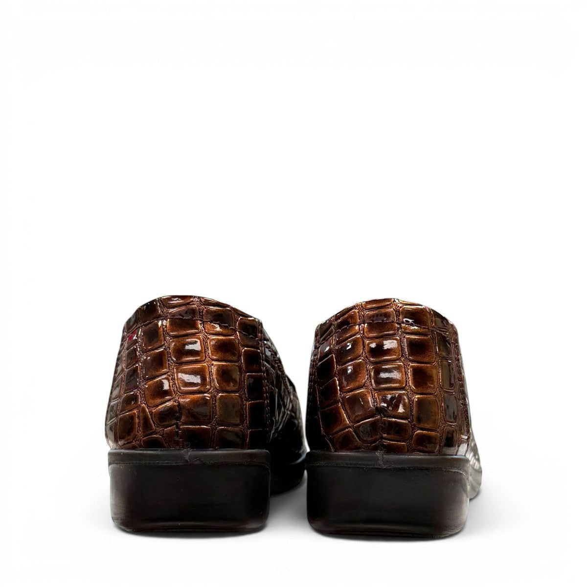 Stefania bronze croc-embossed slip-on shoe with a low wedge sole and elastic side panel.
photo of the back side