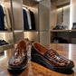 Stefania bronze croc-embossed slip-on shoe with a low wedge sole and elastic side panel.
photo of the front side