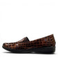 Stefania bronze croc-embossed slip-on shoe with a low wedge sole and elastic side panel.
photo of the left side