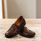 Stefania bronze croc-embossed slip-on shoe with a low wedge sole and elastic side panel.
photo of the front side