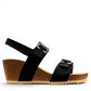 stefania dalia black double-strap wedge sandals with adjustable buckles, cushioned footbed, and cork-style platform sole.
photo of the right side
