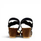 stefania dalia black double-strap wedge sandals with adjustable buckles, cushioned footbed, and cork-style platform sole.
photo of the back side
