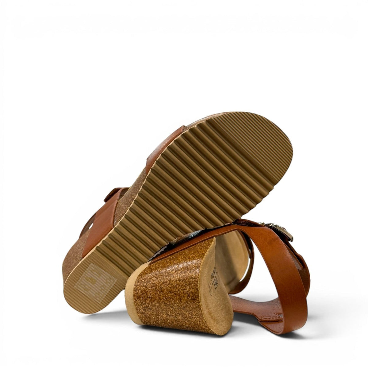 stefania-dalia brown double-strap wedge sandals with adjustable buckles and a cushioned cork-style platform sole.
photo of the bottom side