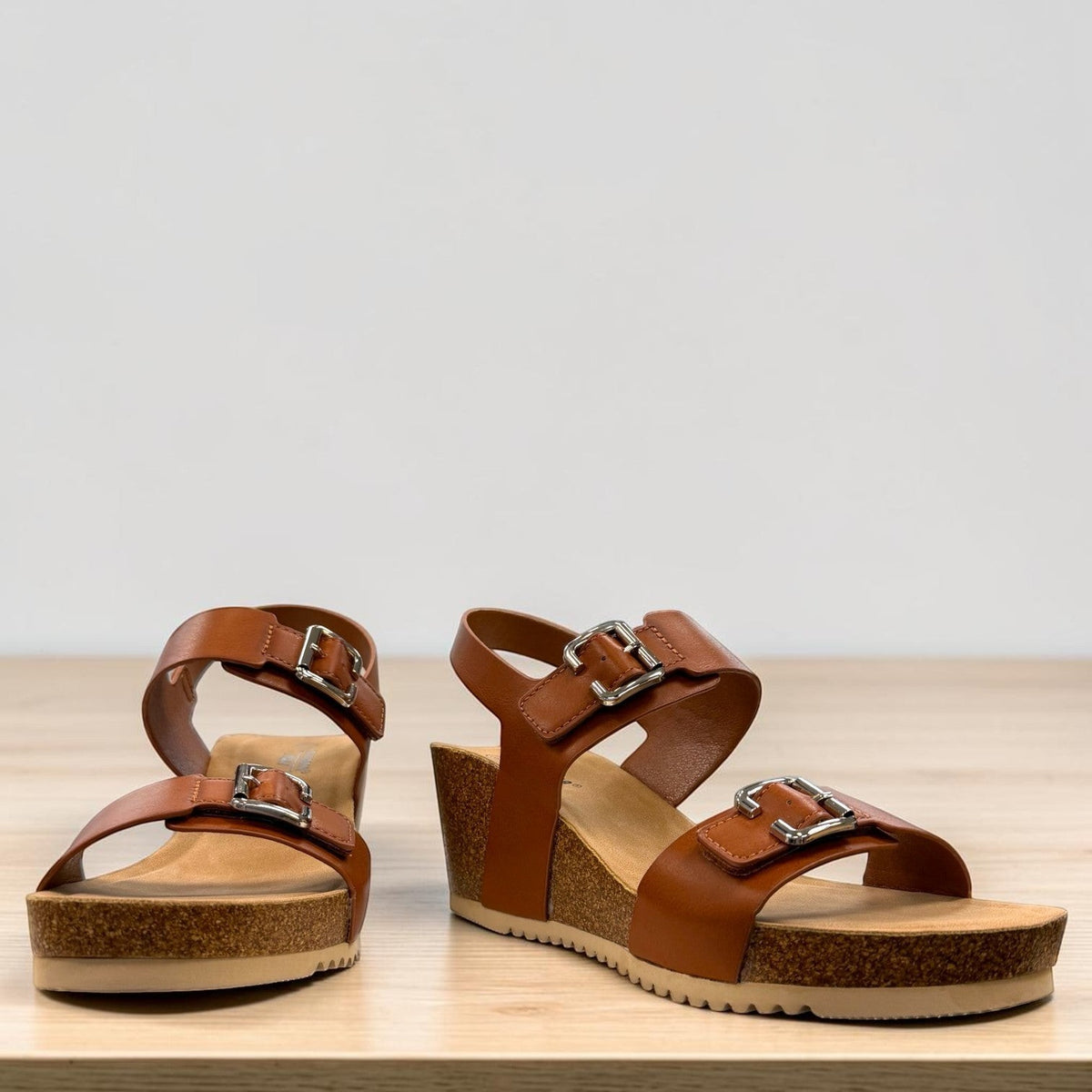 stefania-dalia brown double-strap wedge sandals with adjustable buckles and a cushioned cork-style platform sole.
photo of the front side