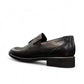 Sun Arad black leather slip-on shoes with woven texture detail and durable rubber outsole. Photo of back view.