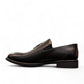 Sun Arad black leather slip-on shoes with woven texture detail and durable rubber outsole. Photo of right side view.