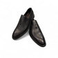 Sun Arad black leather slip-on shoes with woven texture detail and durable rubber outsole. Photo of upper view.