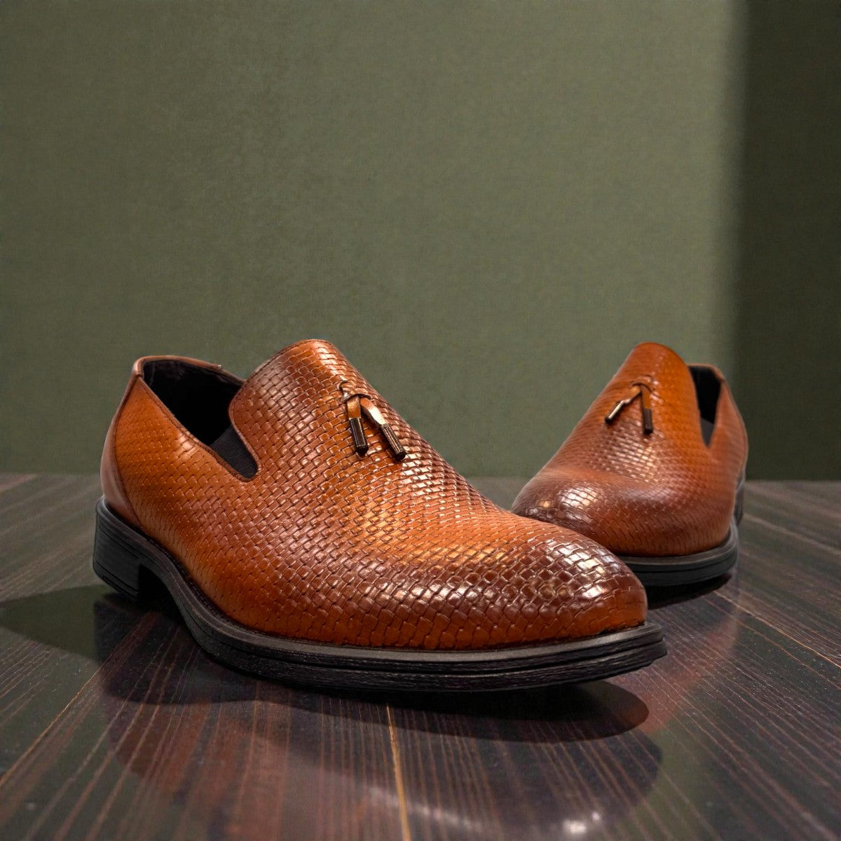 Sun Arad brown leather loafers with a woven texture, refined stitching, and a durable rubber outsole. Photo of front view.
