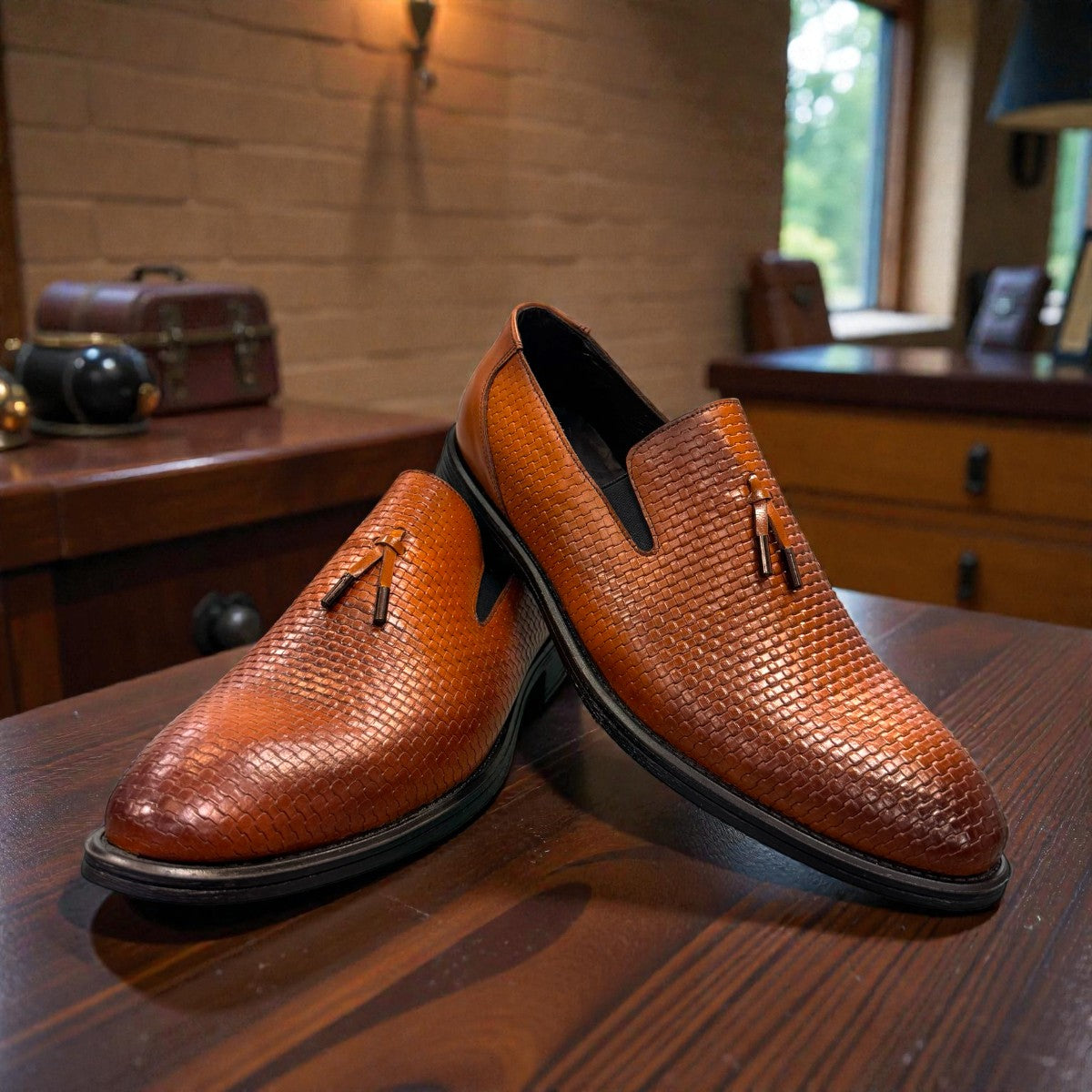 Sun Arad brown leather loafers with a woven texture, refined stitching, and a durable rubber outsole. Photo of front view.