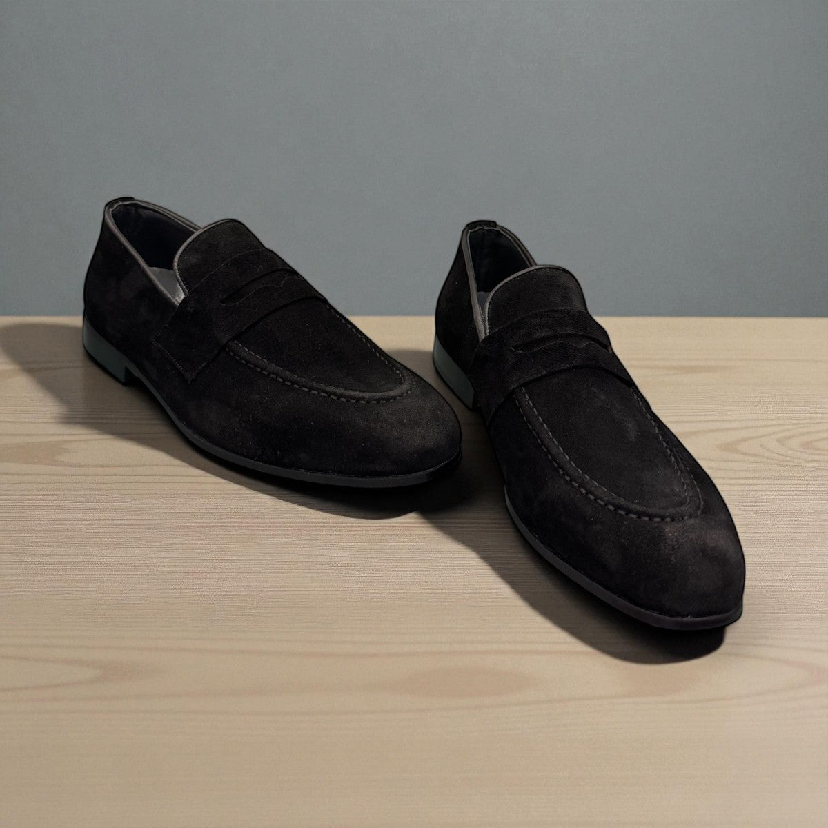 Sun Ashkan black suede loafer with a classic penny strap design and durable rubber outsole. Photo of upper view 2.