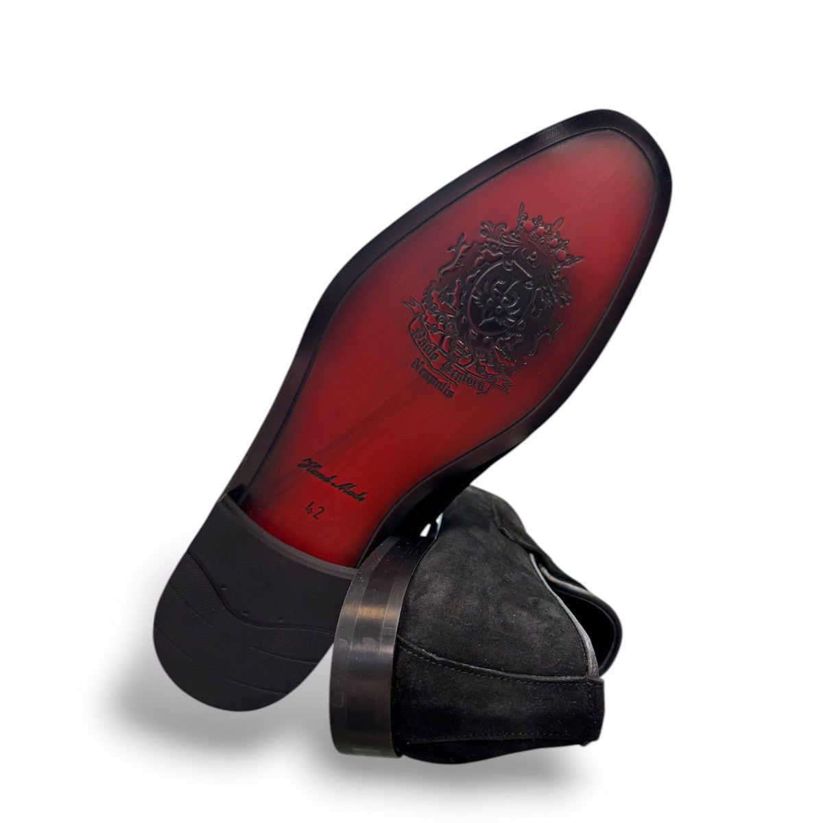 Sun Ashkan black suede loafer with a classic penny strap design and durable rubber outsole. Photo of bottom view.