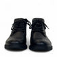 Sun Farshid black leather lace-up boot with a durable rubber outsole and embossed logo detail. Photo of front view.