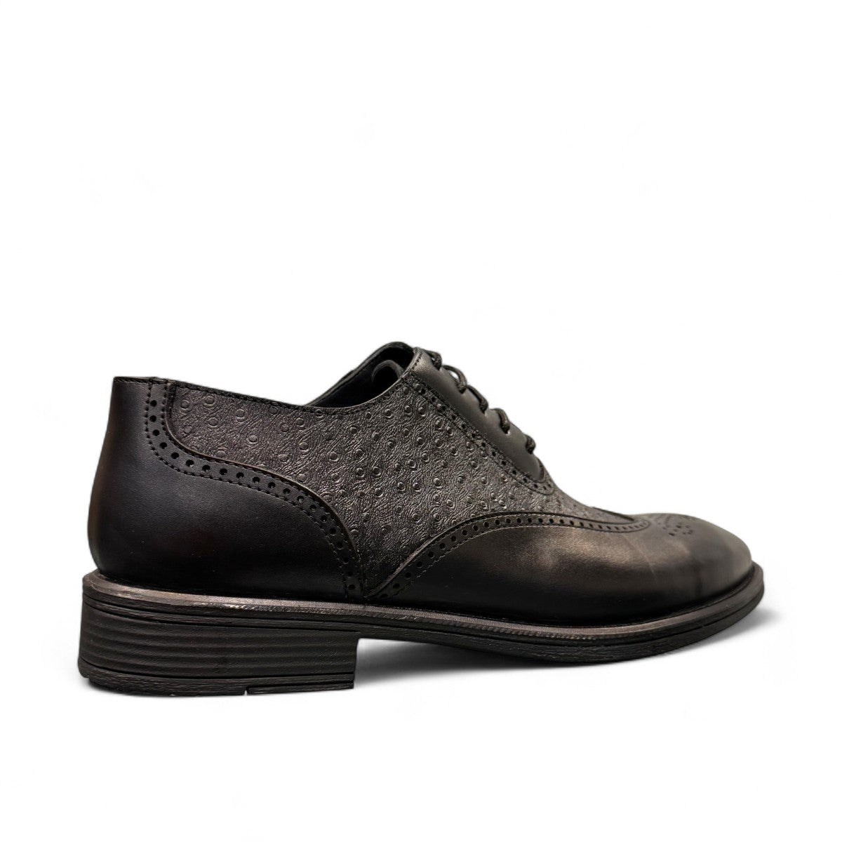 Sun Hesamak black leather lace-up dress shoe with brogue detailing and a durable rubber outsole. Photo of back view.