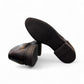 Sun Hesamak black leather lace-up dress shoe with brogue detailing and a durable rubber outsole. Photo of bottom view.