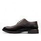 Sun Hesamak black leather lace-up dress shoe with brogue detailing and a durable rubber outsole. Photo of right side view.