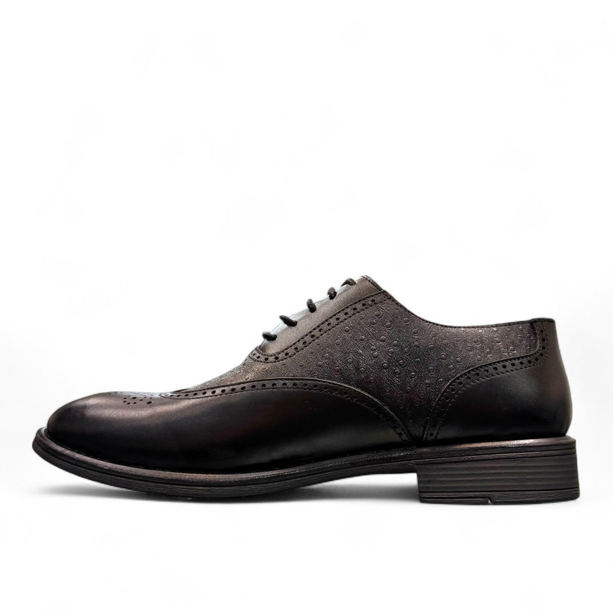 Sun Hesamak black leather lace-up dress shoe with brogue detailing and a durable rubber outsole. Photo of right side view.