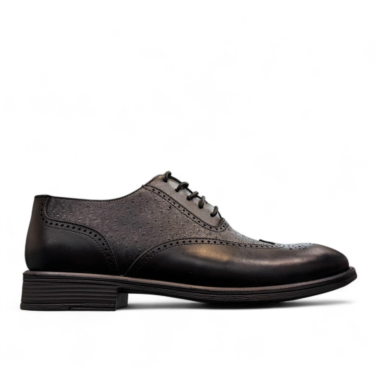 Sun Hesamak black leather lace-up dress shoe with brogue detailing and a durable rubber outsole. Photo of left side view.