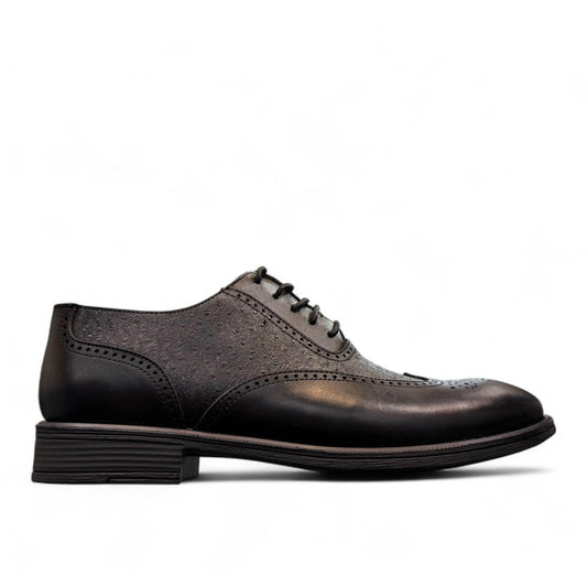 Sun Hesamak black leather lace-up dress shoe with brogue detailing and a durable rubber outsole. Photo of left side view.