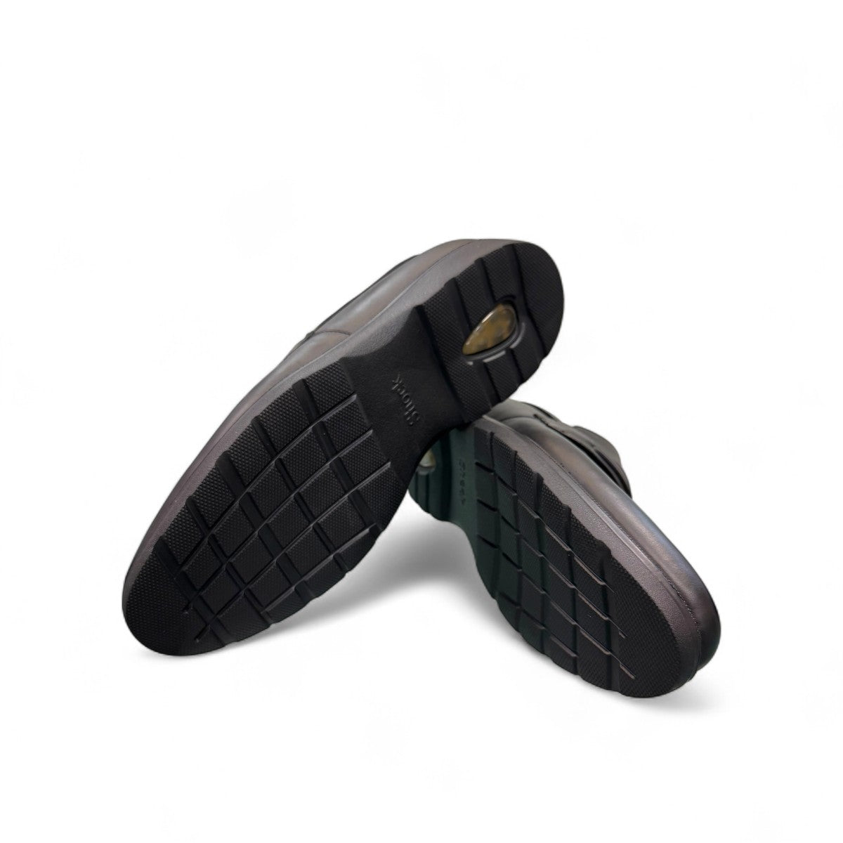 Sun Maku black leather loafer with a polished finish and durable rubber outsole for formal wear. Photo of bottom view.