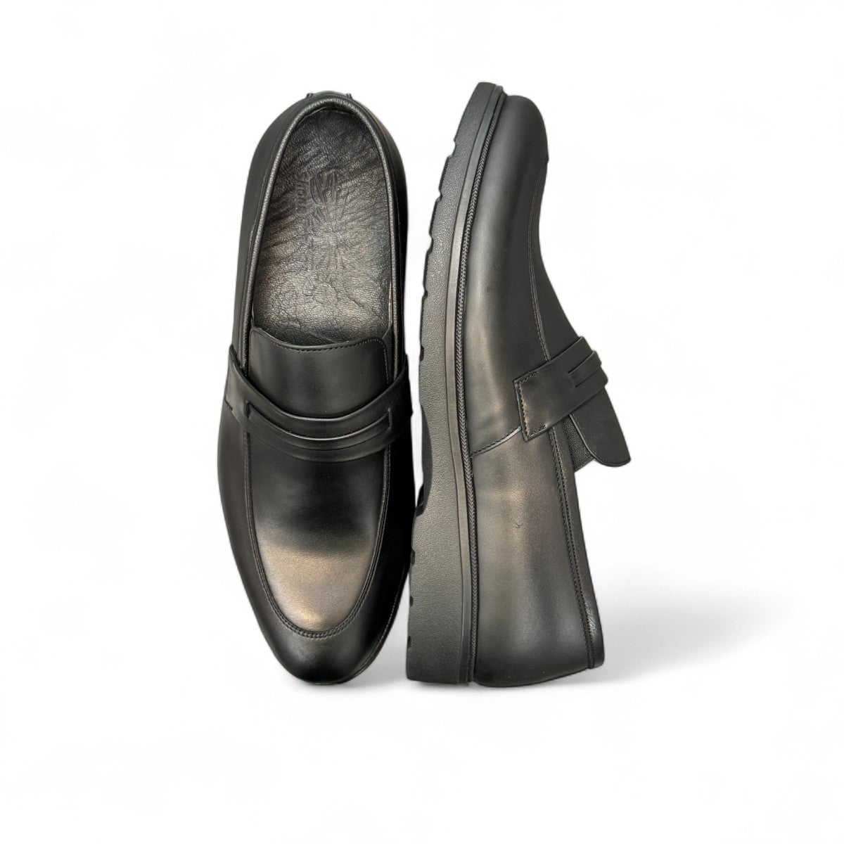 Sun Maku black leather loafer with a polished finish and durable rubber outsole for formal wear. Photo of sole.