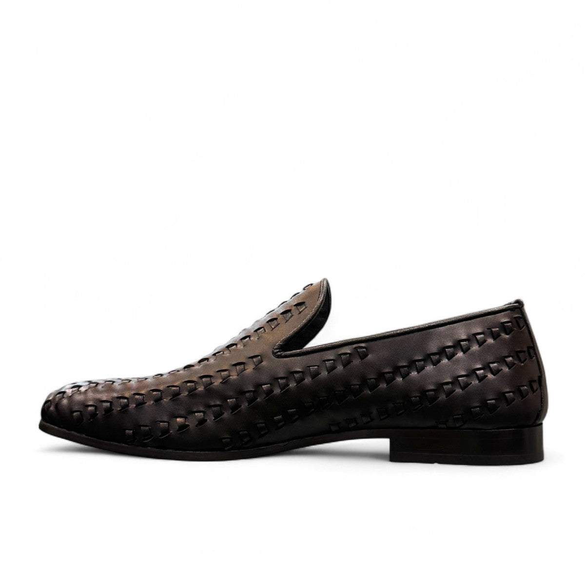 Sun Roniya black leather loafers featuring intricate handmade woven detailing and a rubber outsole. Photo of inside side view.