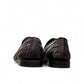 Sun Roniya black leather loafers featuring intricate handmade woven detailing and a rubber outsole. Photo of back view.