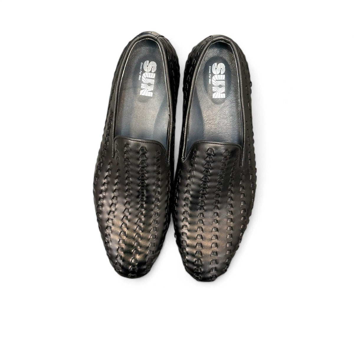 Sun Roniya black leather loafers featuring intricate handmade woven detailing and a rubber outsole. Photo of upper view.