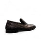Sun Roniya black leather loafers featuring intricate handmade woven detailing and a rubber outsole. Photo of back view from a side angle.