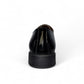 Sun Vali black patent leather lace-up dress shoe with refined stitching and durable rubber outsole. Photo of back view.