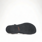Taos Big Time black leather walking sandals with adjustable hook and loop straps and arch support. Photo of bottom view.