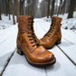 Taos Crave classic camel leather lace-up boot with side buckle and block heel. Photo of front view.