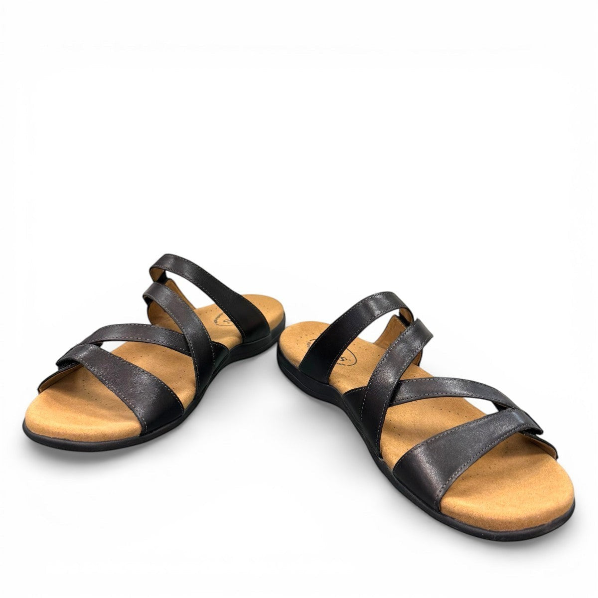 Taos Double U black leather slide sandal with adjustable hook and loop straps and cushioned foot bed. Photo of front view 2.