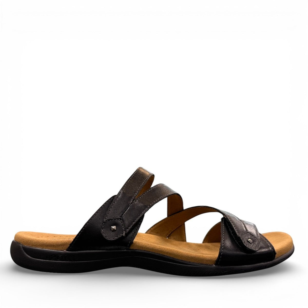 Taos Double U black leather slide sandal with adjustable hook and loop straps and cushioned foot bed. Photo of outside side view.
