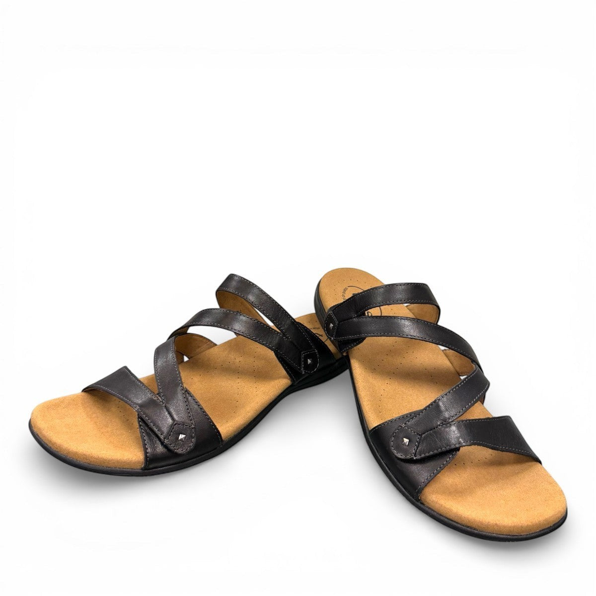 Taos Double U black leather slide sandal with adjustable hook and loop straps and cushioned foot bed. Photo of front view.