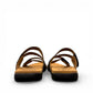 Taos Double U black leather slide sandal with adjustable hook and loop straps and cushioned foot bed. Photo of back view.