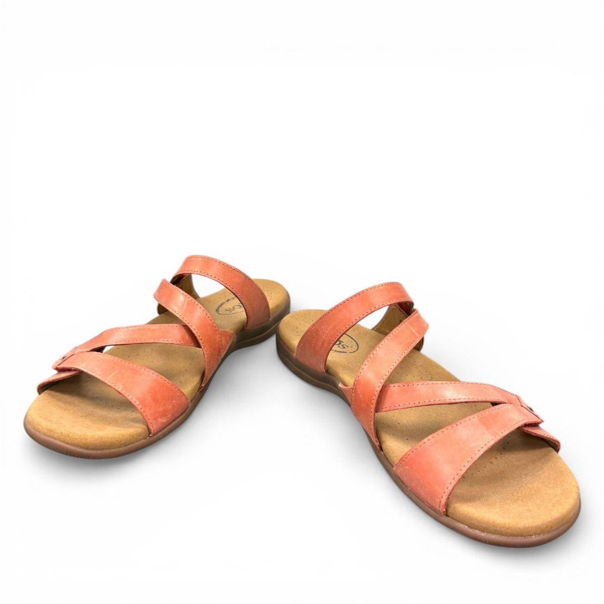 Taos Double U leather slide sandals in bruschetta red with adjustable hook and loop straps. Photo of front view at an angle.