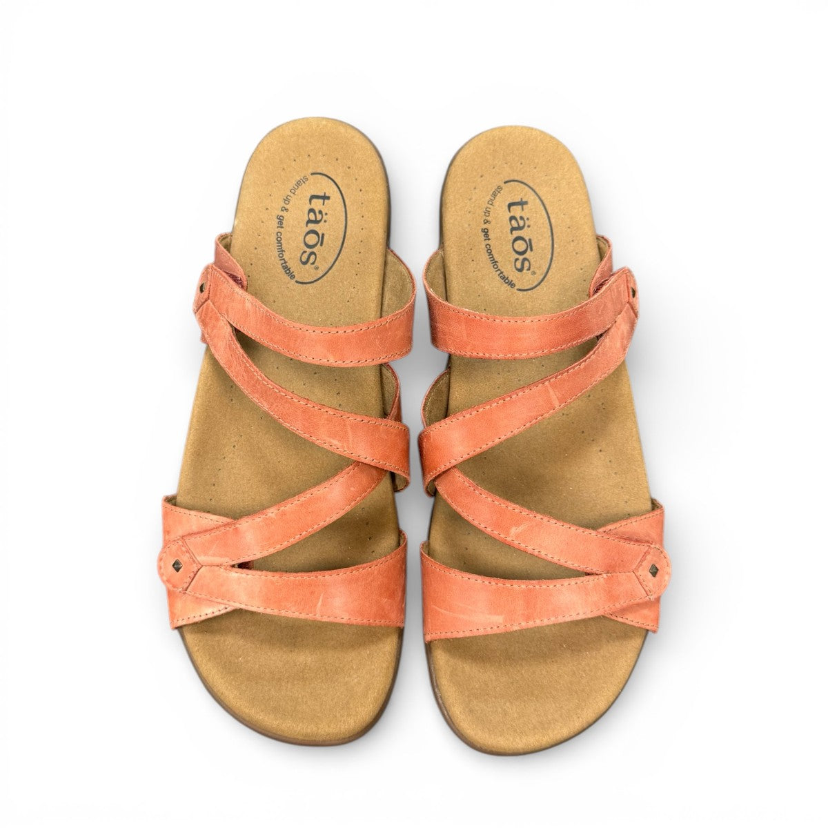 Taos Double U leather slide sandals in bruschetta red with adjustable hook and loop straps. Photo of upper view.