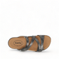 Taos Double U pewter leather slide sandal with adjustable hook and loop straps and cushioned footbed. Photo of upper view.