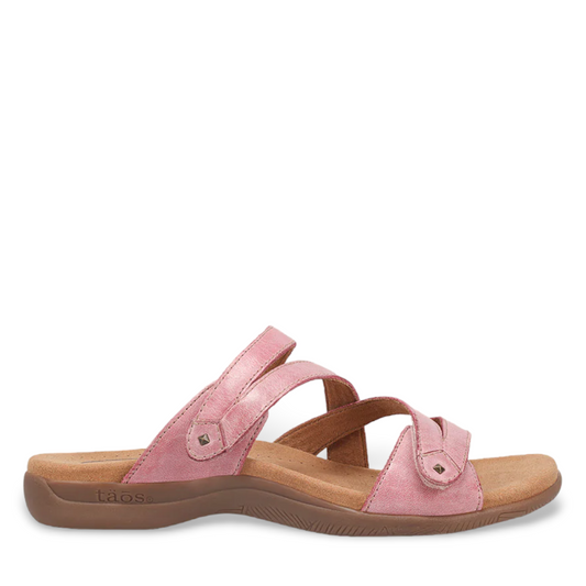 Taos Double U rustic pink leather slide sandal with adjustable hook and loop straps and arch support. Photo of side view.