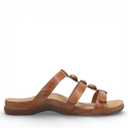 Taos Gemma hazelnut leather slide sandal with decorative stone accents and adjustable velcro straps. Photo of outside side view.