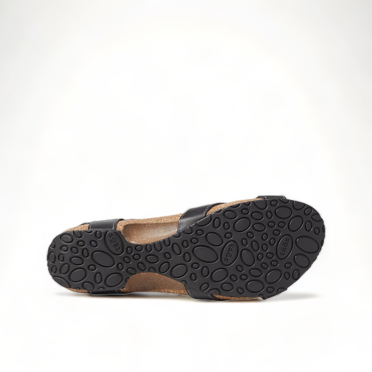 Taos Locke black leather sandal with adjustable hook and loop straps and a supportive cork footbed. Photo of bottom view.