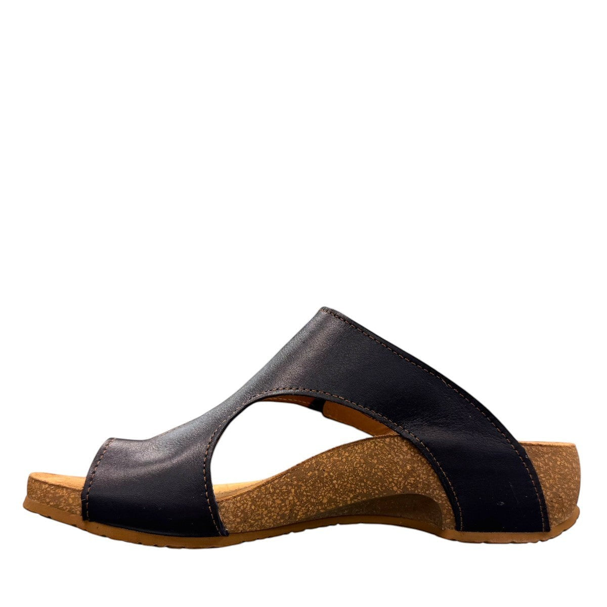 Taos Loop navy leather toe-post sandal with adjustable hook-and-loop strap and cushioned cork foot bed. Photo of inside side view.