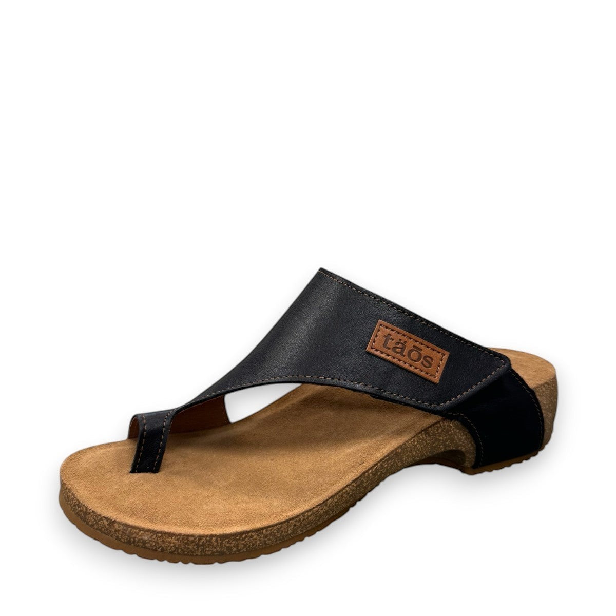 Taos Loop navy leather toe-post sandal with adjustable hook-and-loop strap and cushioned cork foot bed. Photo of front view.